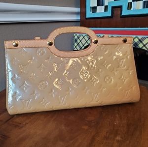 * Retired * Louis Vuitton Roxbury